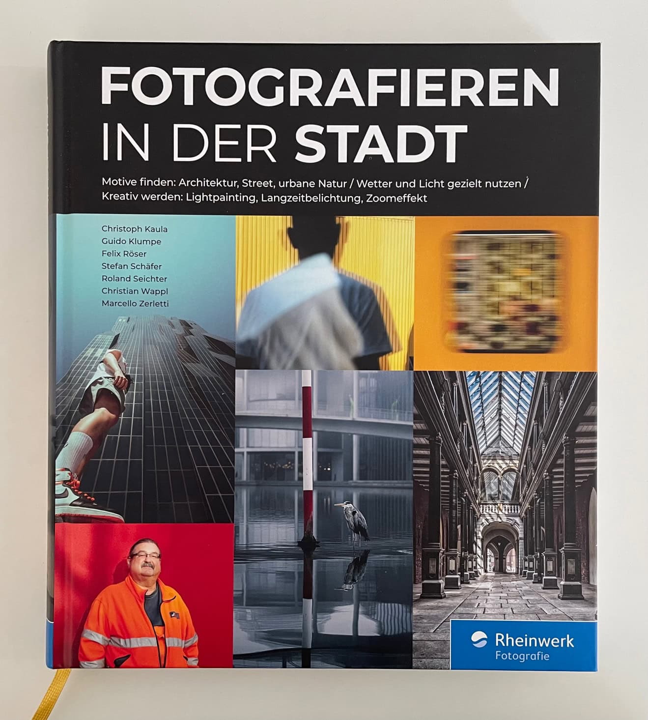 Buchcover "Fotografieren in der Stadt" mit urbanen Motiven und Architektur.